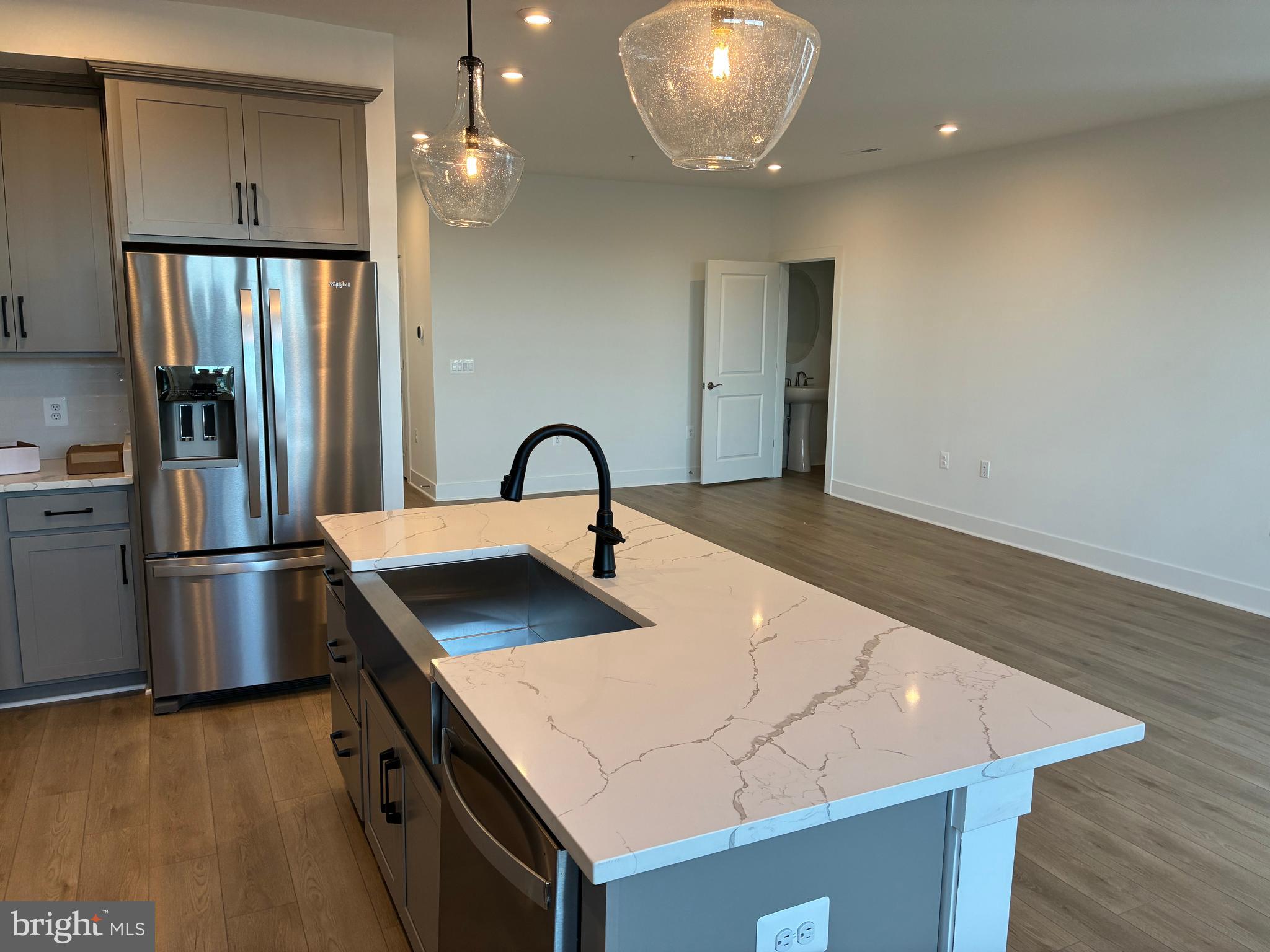 248 Violet Way, Unit 2 Stafford, VA 22554 - Photo 4 of 41 a kitchen with kitchen island a sink appliances and cabinets