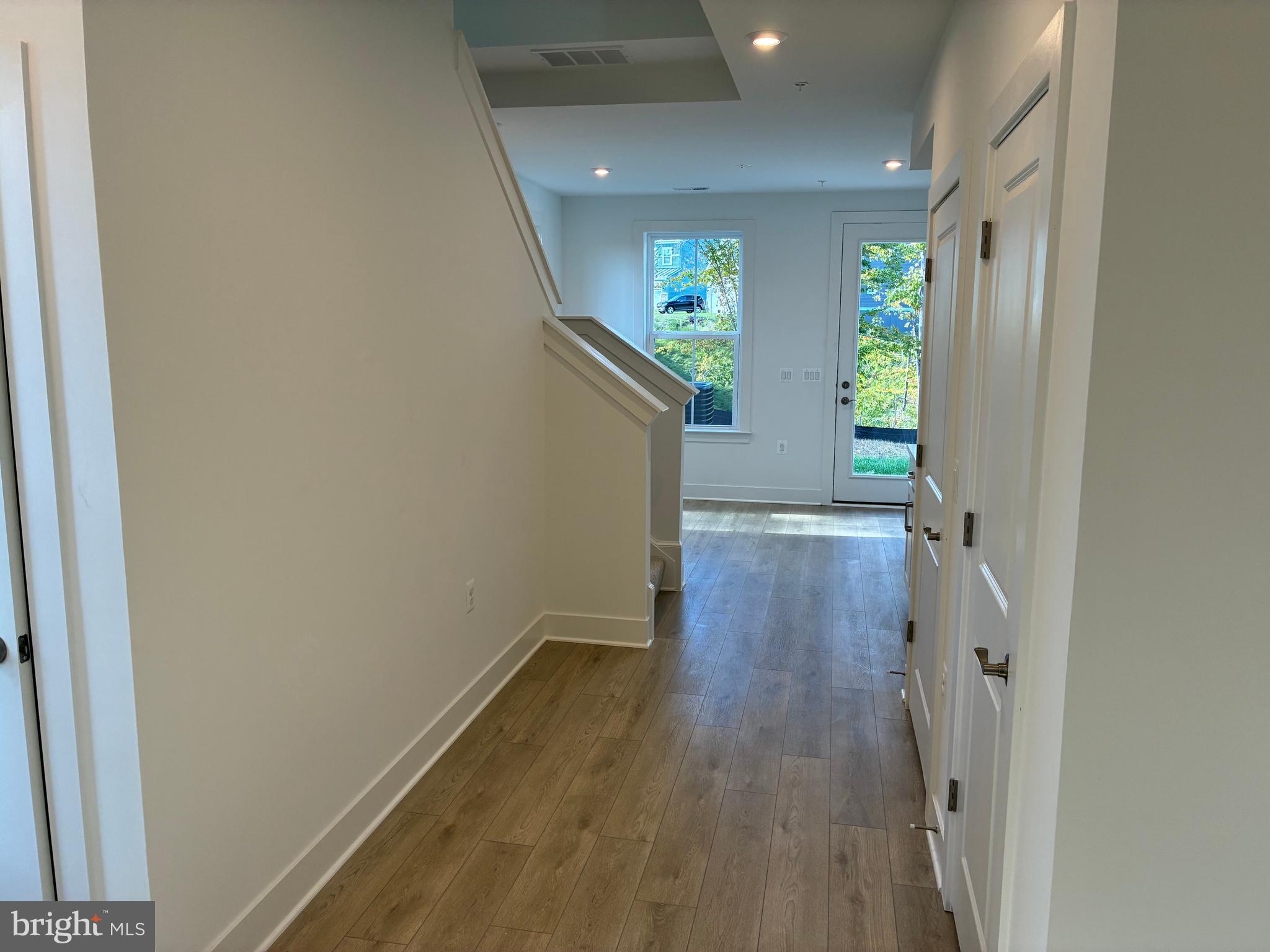 248 Violet Way, Unit 2 Stafford, VA 22554 - Photo 6 of 41 a view of a hallway with wooden floor and staircase