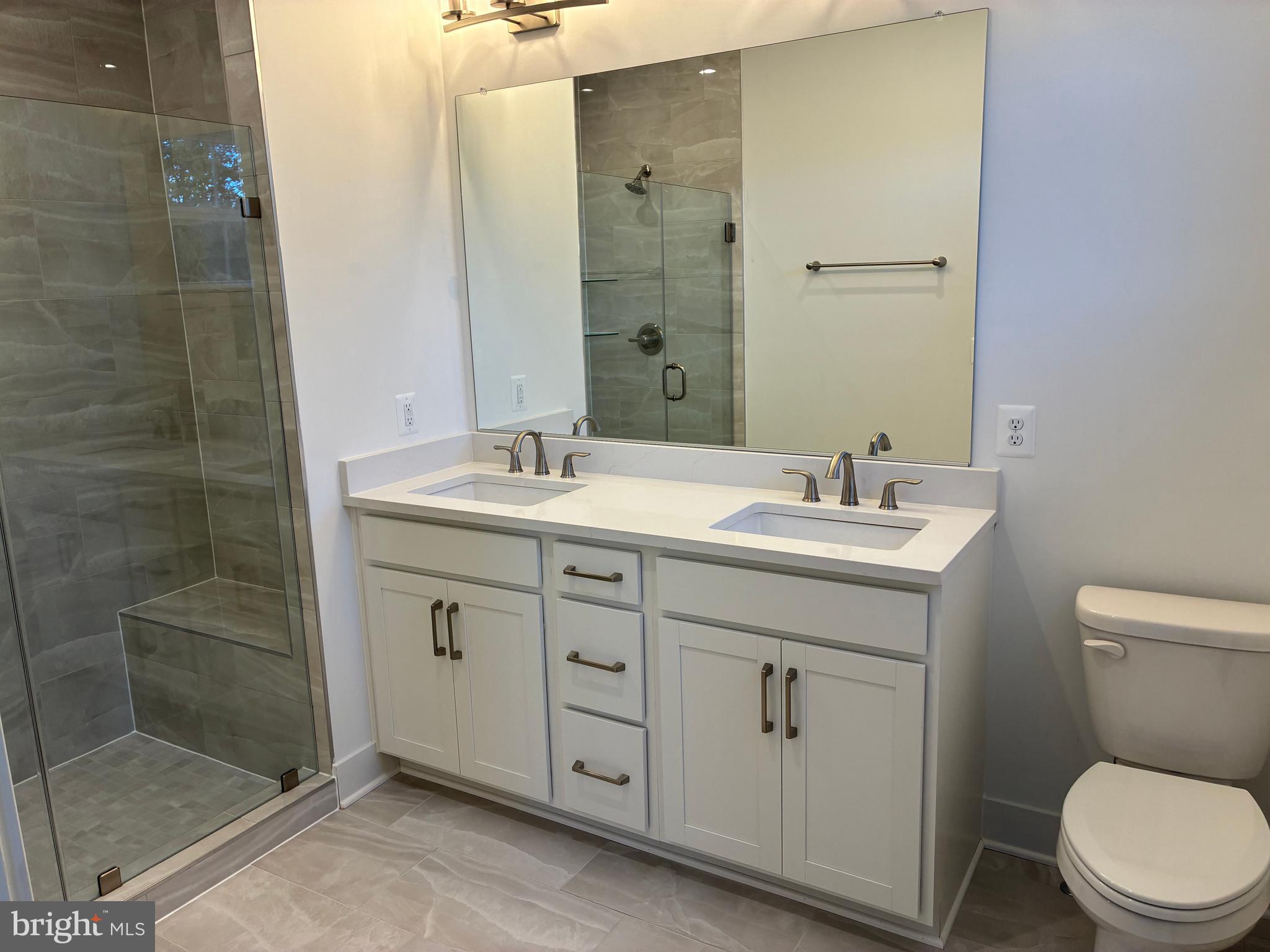 248 Violet Way, Unit 2 Stafford, VA 22554 - Photo 8 of 41 a bathroom with a double vanity sink toilet and shower