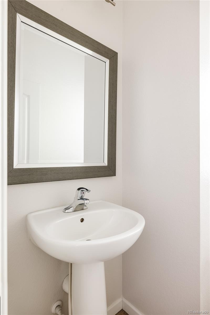 2899 Trinity Loop Broomfield, CO 80023 - Photo 11 of 33 a bathroom with a sink and a mirror