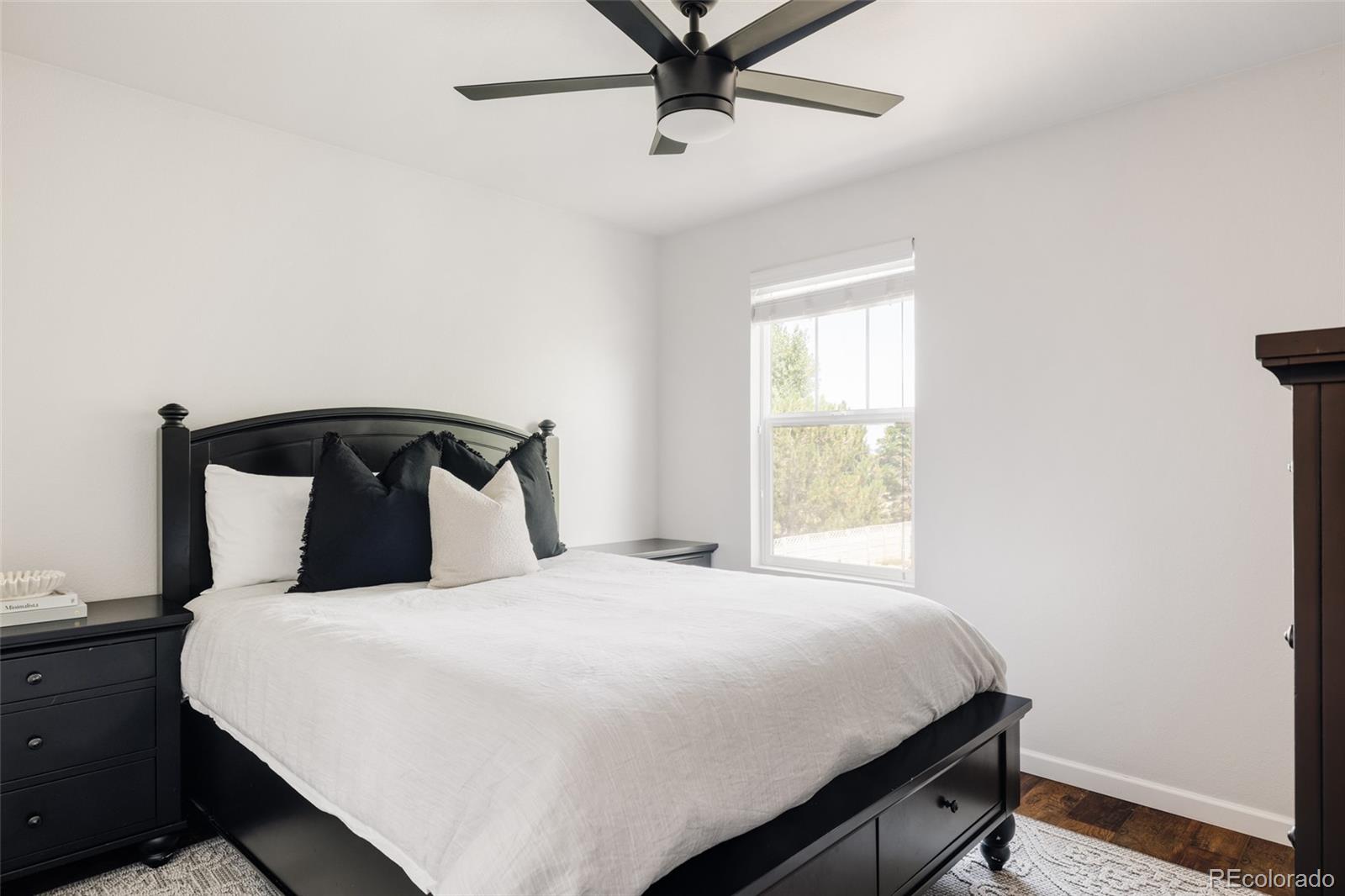 2899 Trinity Loop Broomfield, CO 80023 - Photo 20 of 33 a bedroom with a bed and window
