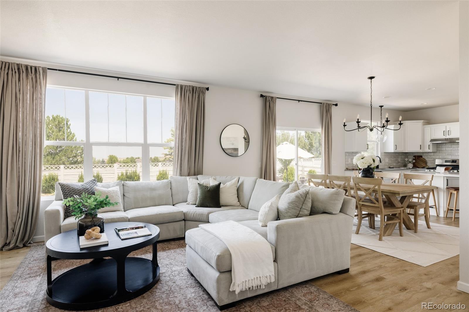 2899 Trinity Loop Broomfield, CO 80023 - Photo 2 of 33 a living room with furniture potted plant and a large window