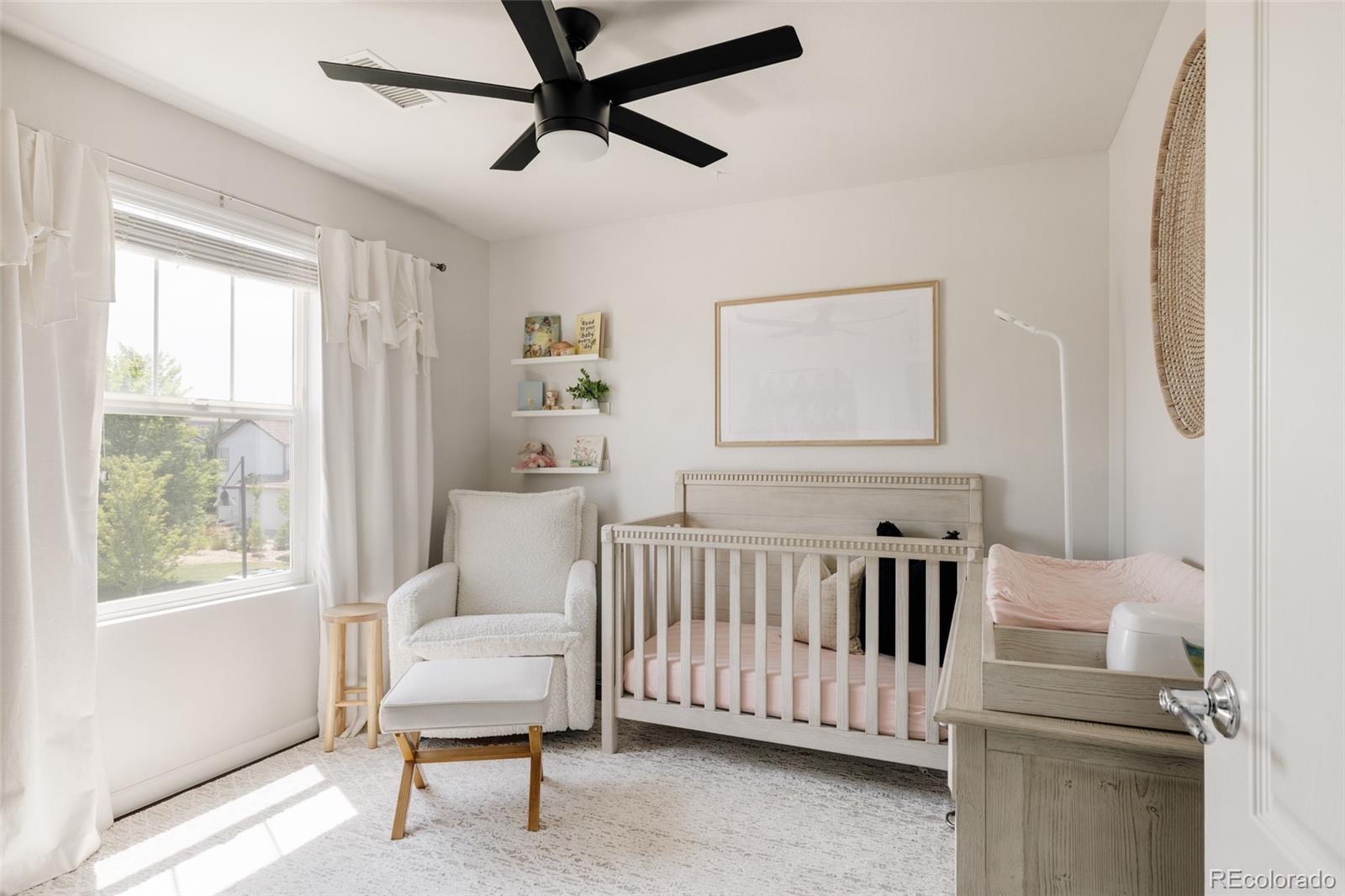 2899 Trinity Loop Broomfield, CO 80023 - Photo 22 of 33 a bedroom with a bed and a window