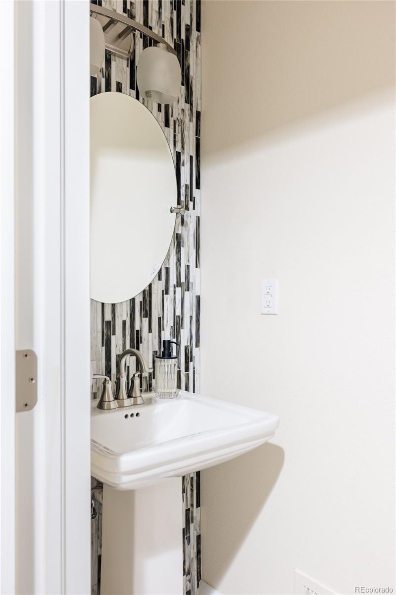 2899 Trinity Loop Broomfield, CO 80023 - Photo 28 of 33 a bathroom with a sink and a mirror
