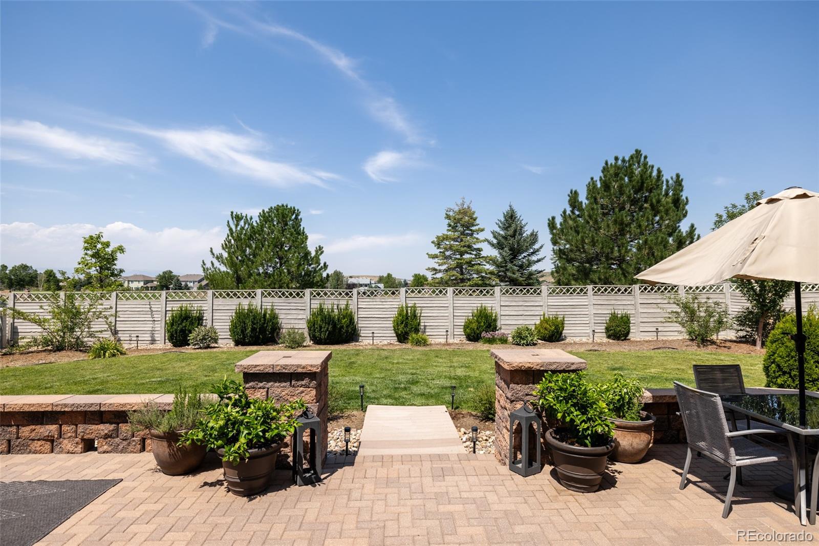 2899 Trinity Loop Broomfield, CO 80023 - Photo 30 of 33 a view of a garden with patio