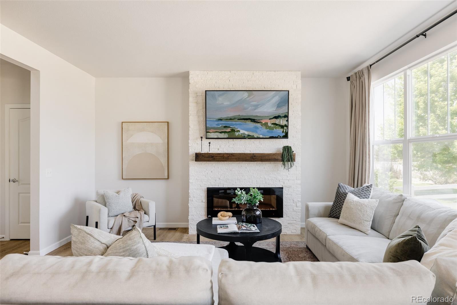 2899 Trinity Loop Broomfield, CO 80023 - Photo 4 of 33 a living room with furniture and a large window