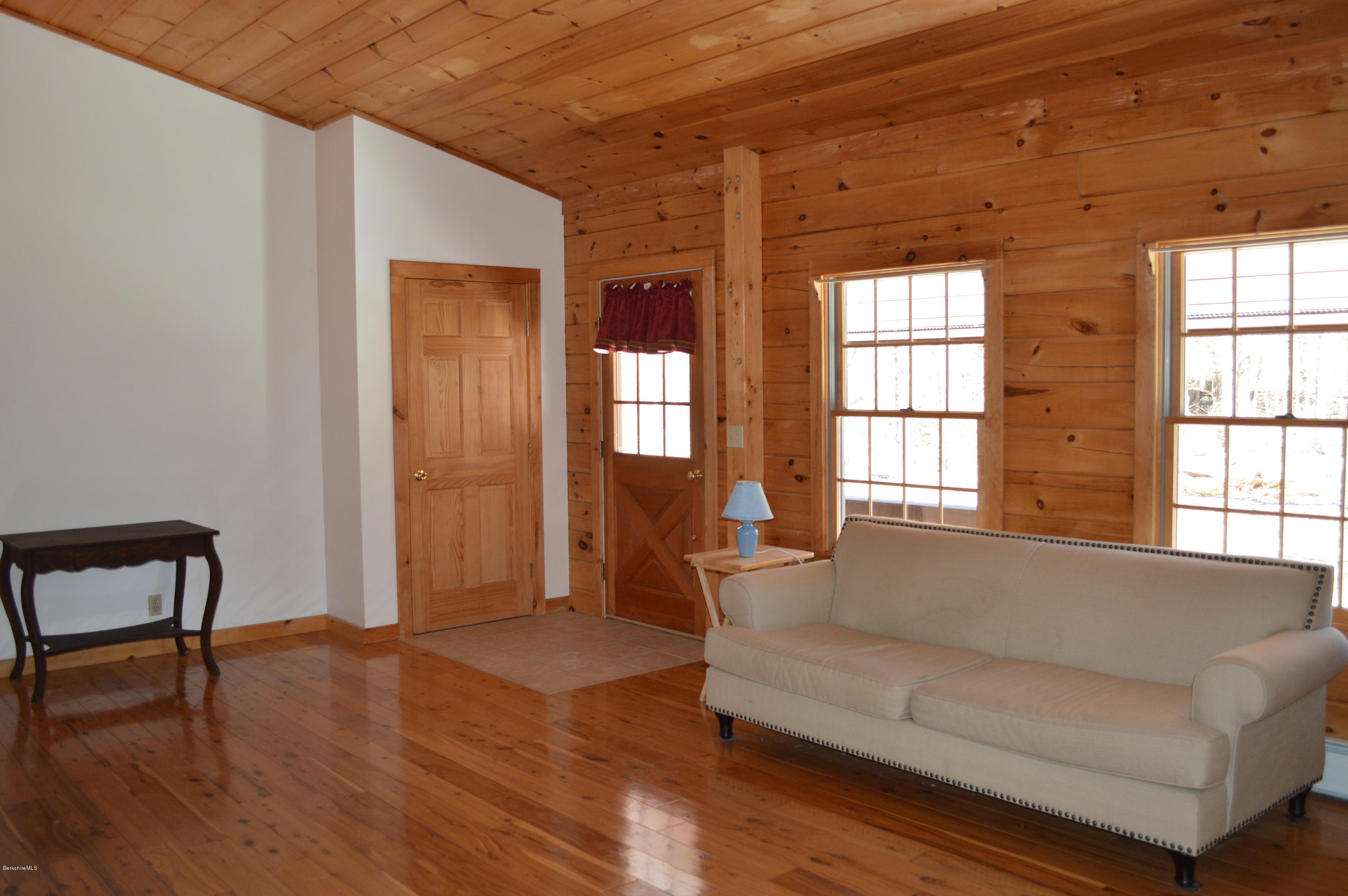 2034 West Center Road Otis, MA 01253 - Photo 16 of 50 a living room with furniture and a window