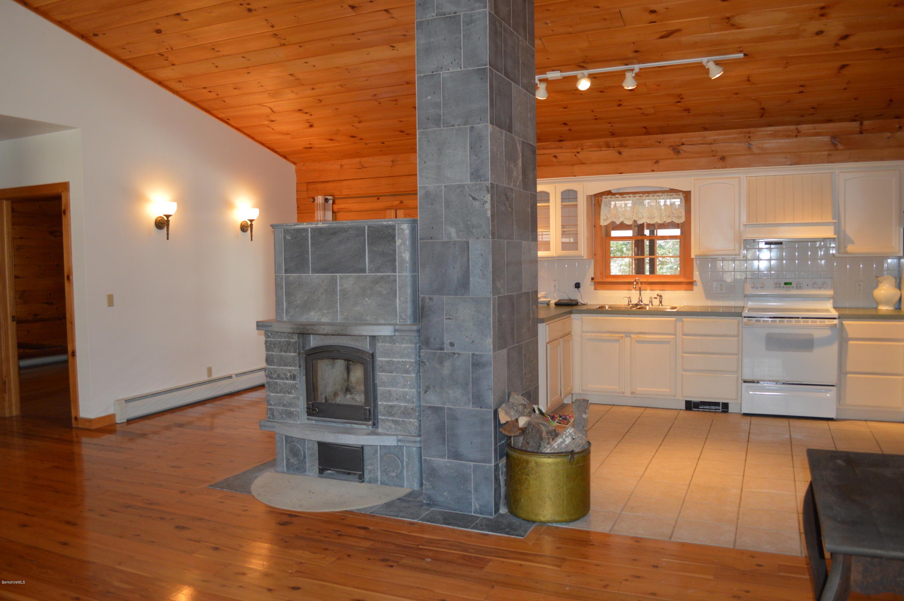 2034 West Center Road Otis, MA 01253 - Photo 17 of 50 a kitchen with a sink and wooden floor