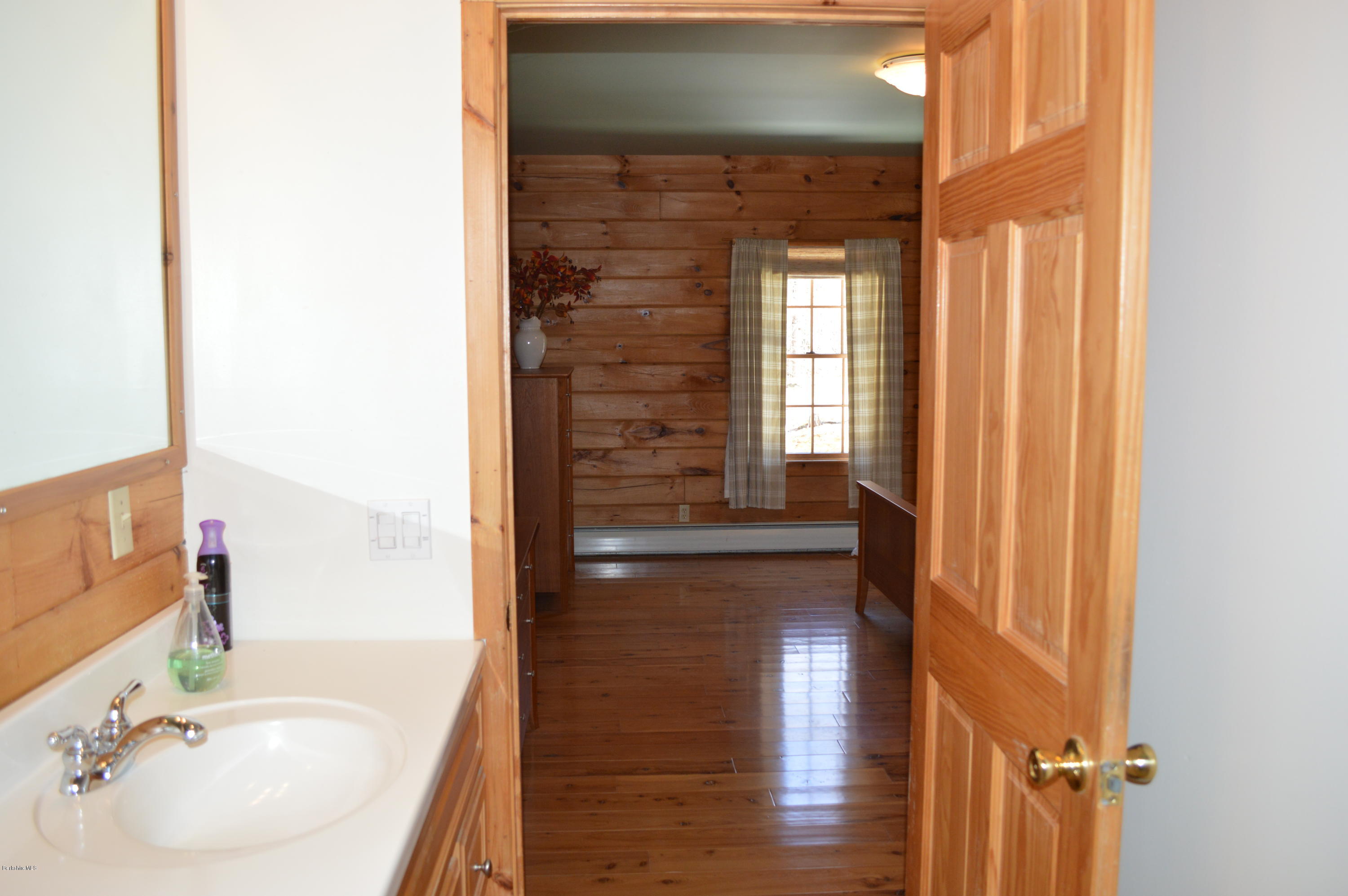 2034 West Center Road Otis, MA 01253 - Photo 20 of 50 a bathroom with a bathtub and a sink