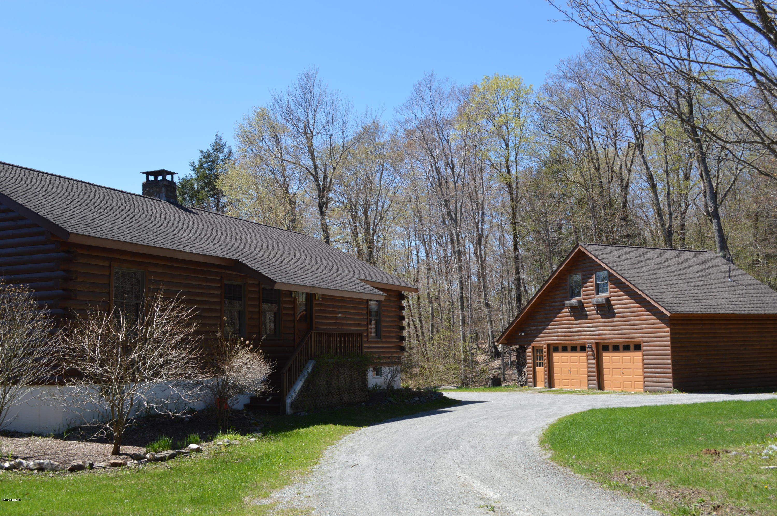 2034 West Center Road Otis, MA 01253 - Photo 3 of 50 a front view of a house with garden