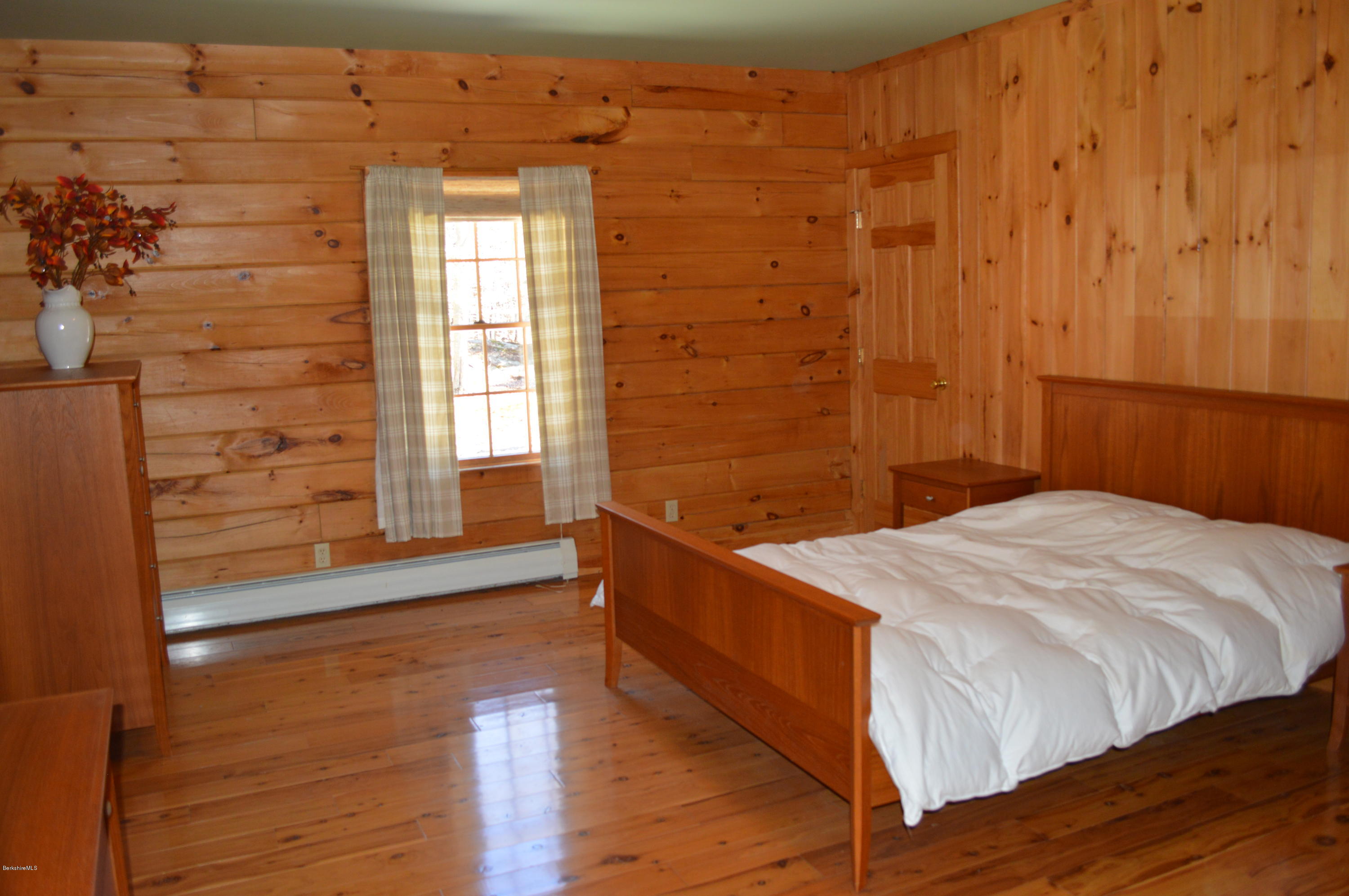 2034 West Center Road Otis, MA 01253 - Photo 22 of 50 a bedroom with a bed and a window