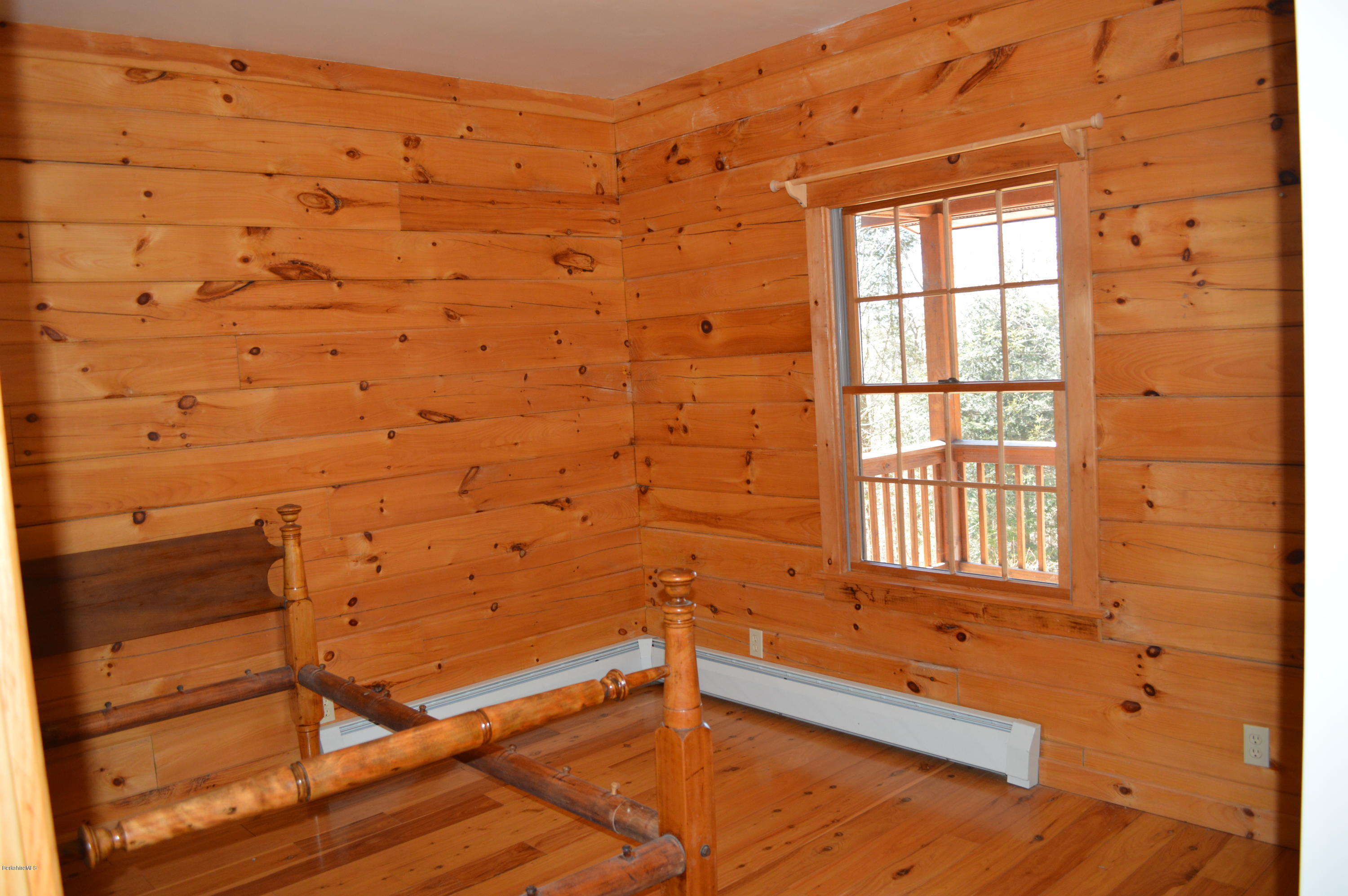 2034 West Center Road Otis, MA 01253 - Photo 23 of 50 a bathroom with a bathtub and window