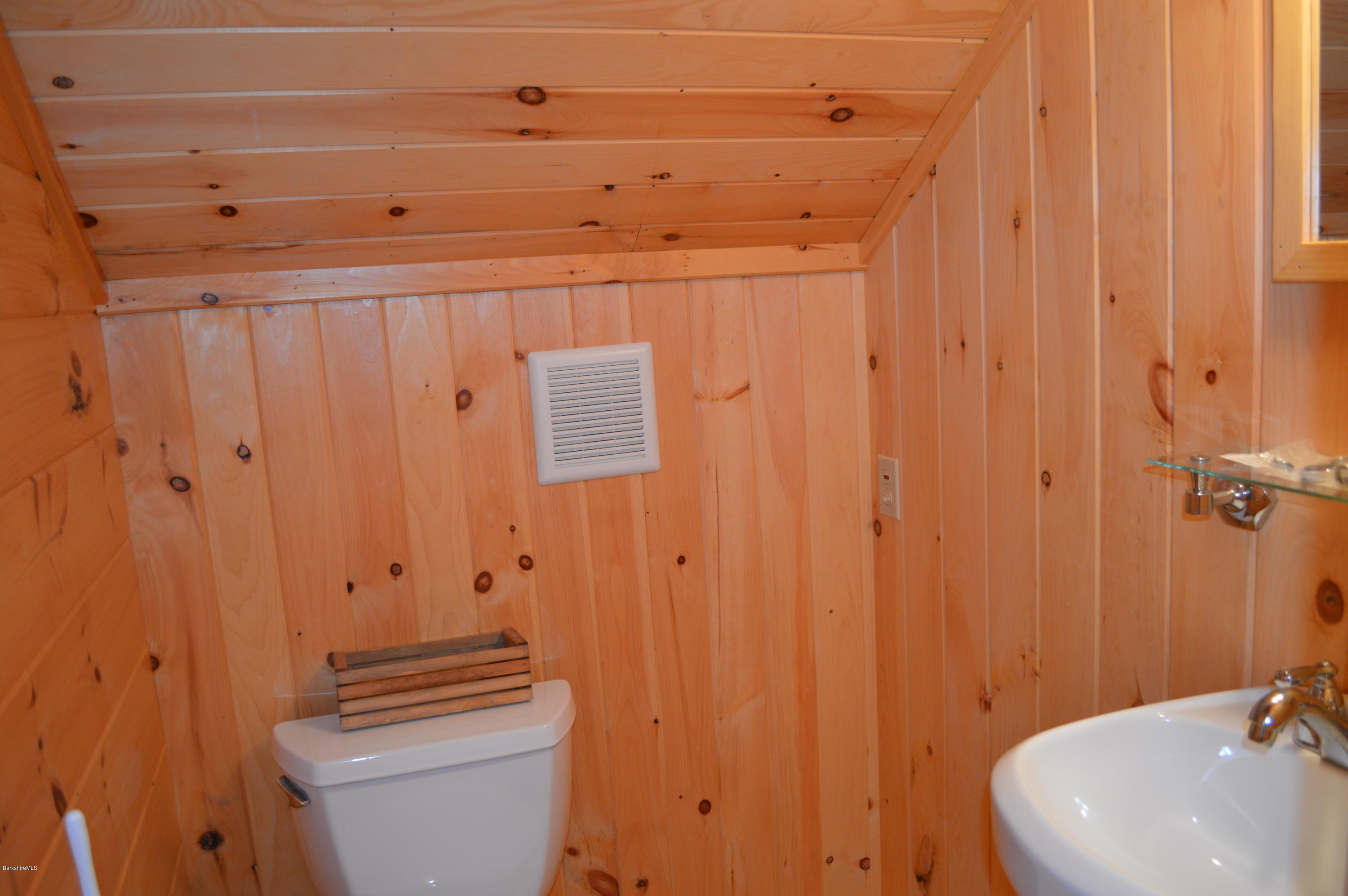 2034 West Center Road Otis, MA 01253 - Photo 28 of 50 a bathroom with a sink a toilet and shower