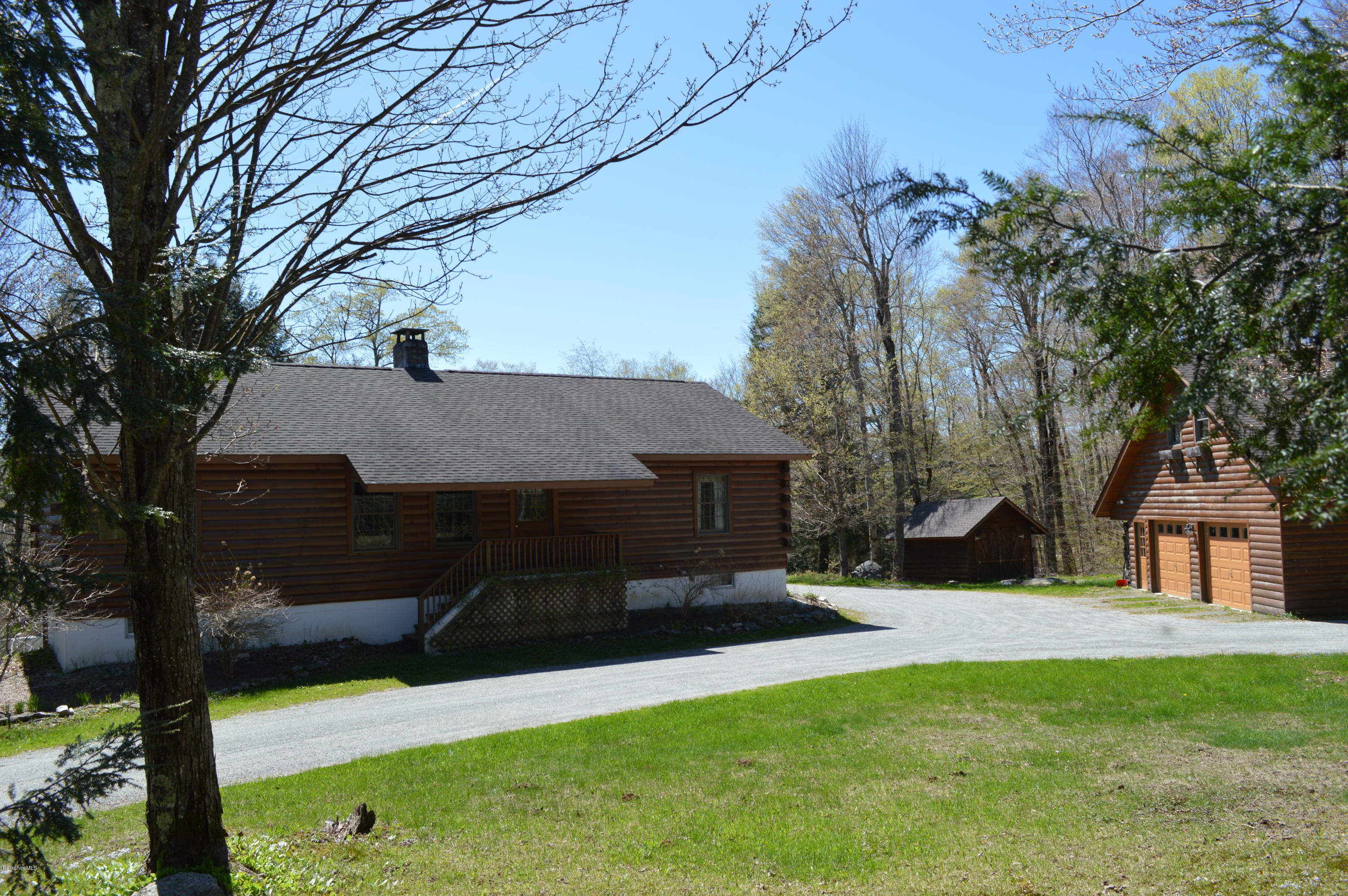 2034 West Center Road Otis, MA 01253 - Photo 42 of 50 a front view of a house with a yard