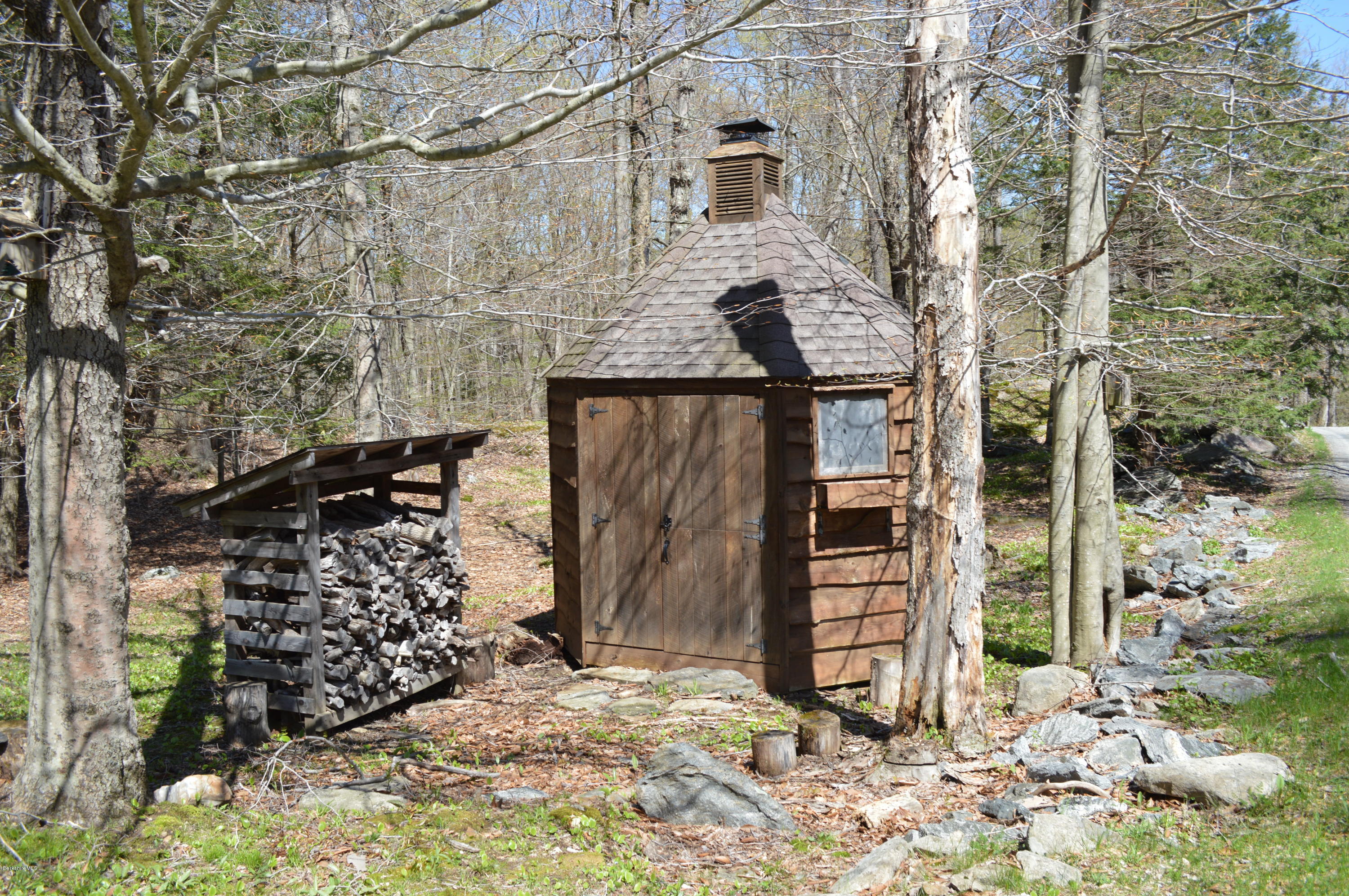 2034 West Center Road Otis, MA 01253 - Photo 45 of 50 a view of a house with a tree in the background