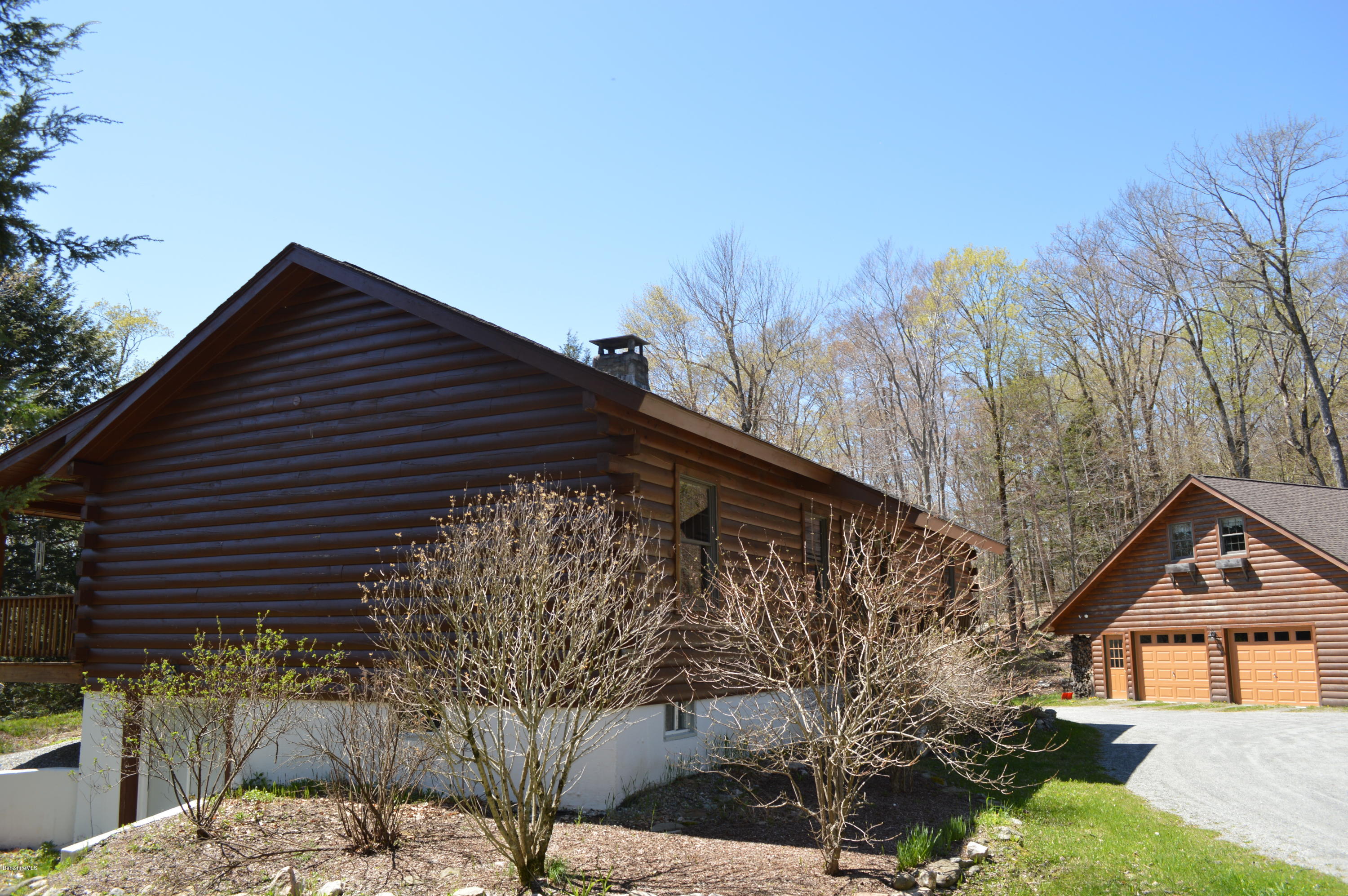 2034 West Center Road Otis, MA 01253 - Photo 46 of 50 a backyard of a house with large trees