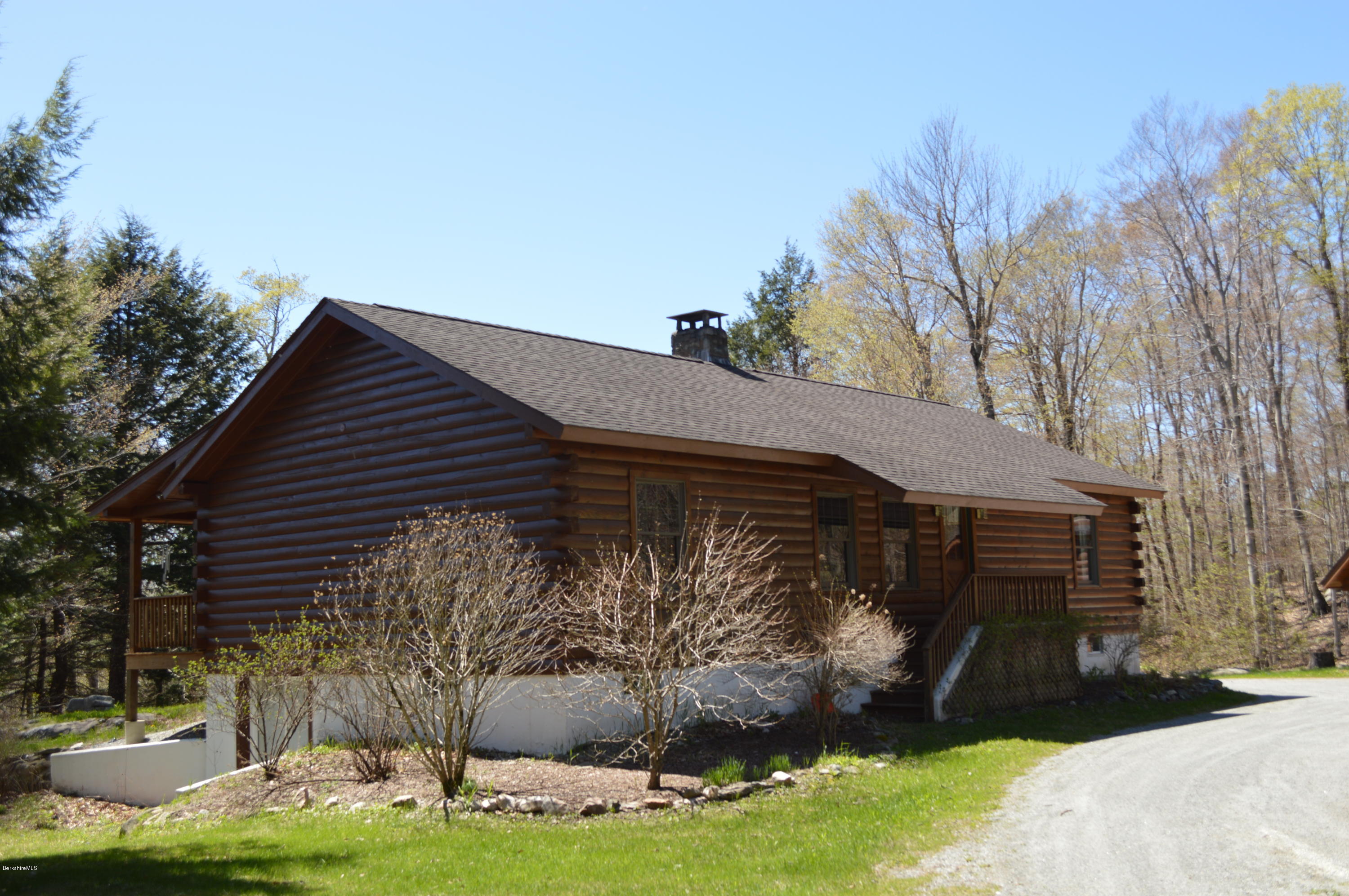 2034 West Center Road Otis, MA 01253 - Photo 6 of 50 a front view of a house with garden