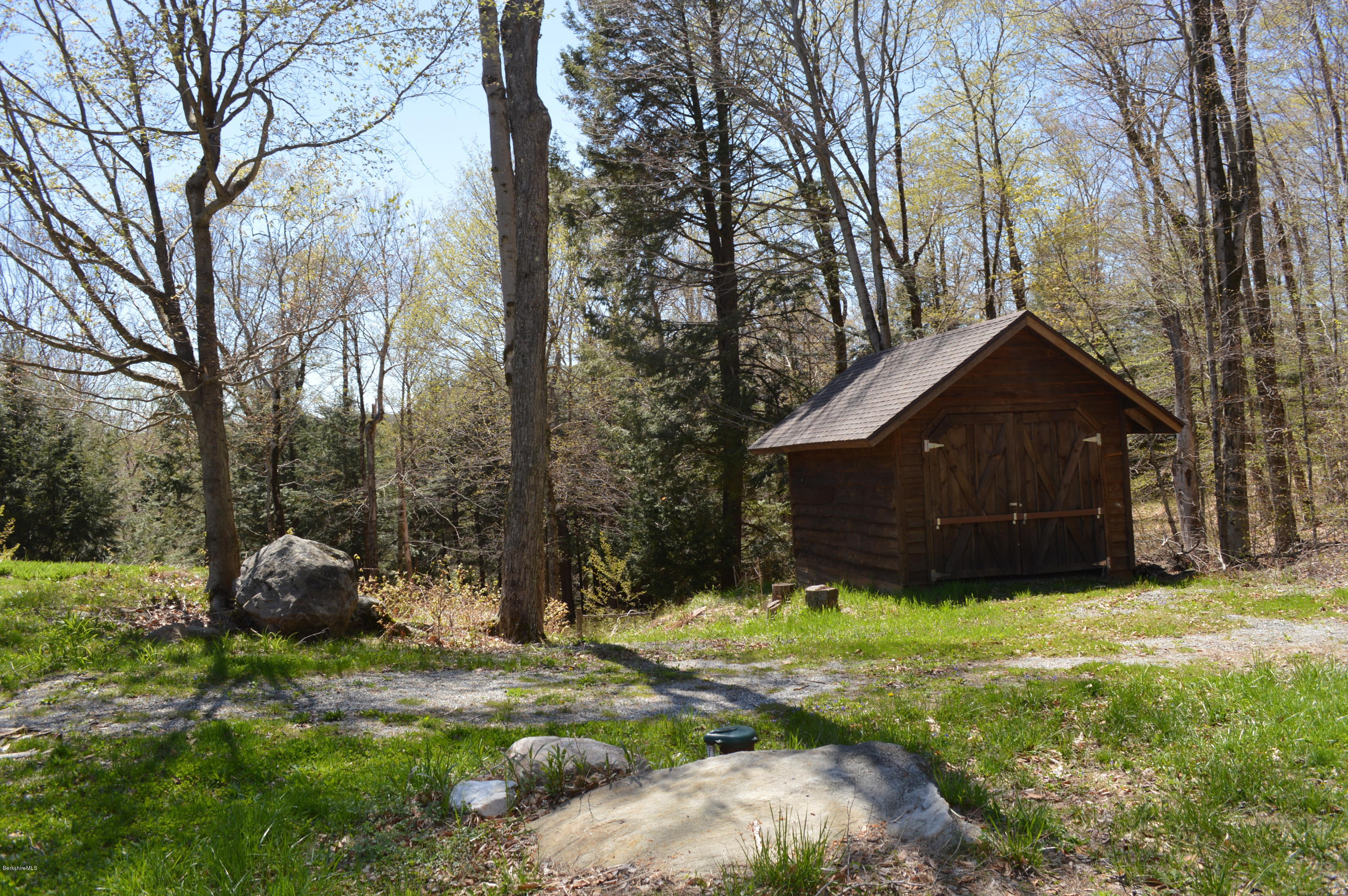2034 West Center Road Otis, MA 01253 - Photo 8 of 50 a house with trees in front of it