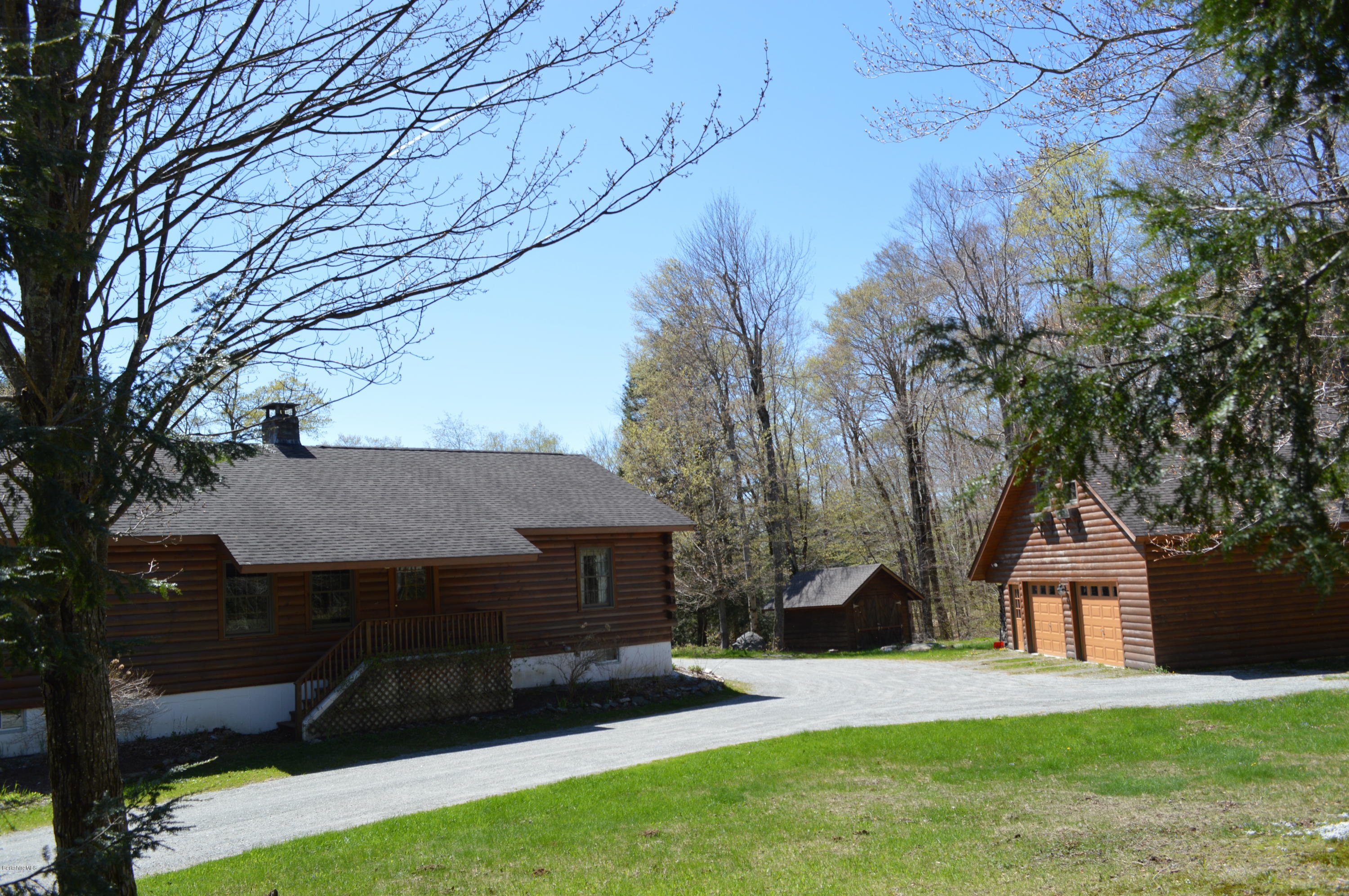 2034 West Center Road Otis, MA 01253 - Photo 9 of 50 a front view of house with yard and trees