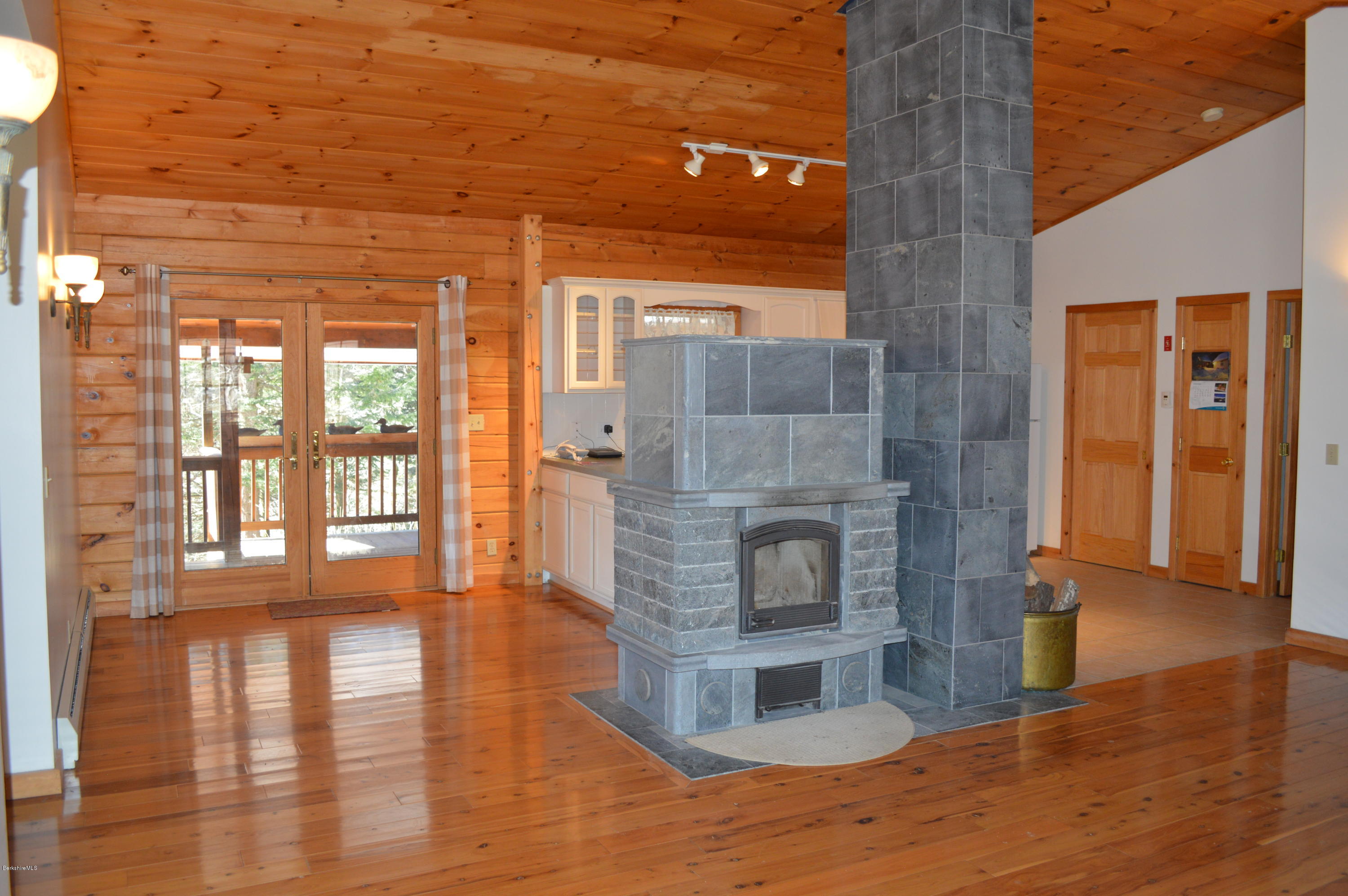 2034 West Center Road Otis, MA 01253 - Photo 10 of 50 a living room with furniture and a fireplace