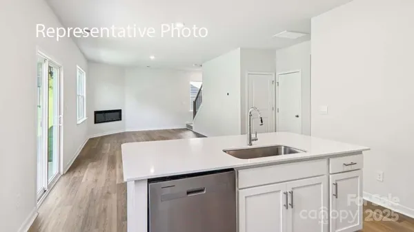 a kitchen with a sink and cabinets
