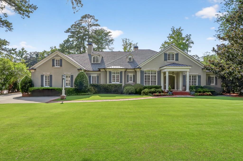 2954 Ridgewood Road Northwest Atlanta, GA 30327 - Photo 1 of 1 a front view of a house with a garden
