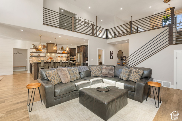 1192 East Ashdown Road Cedar City, UT 84721 - Photo 28 of 96 Vaulted ceilings, wood-finish flooring, and a contemporary open-riser staircase with horizontal railing