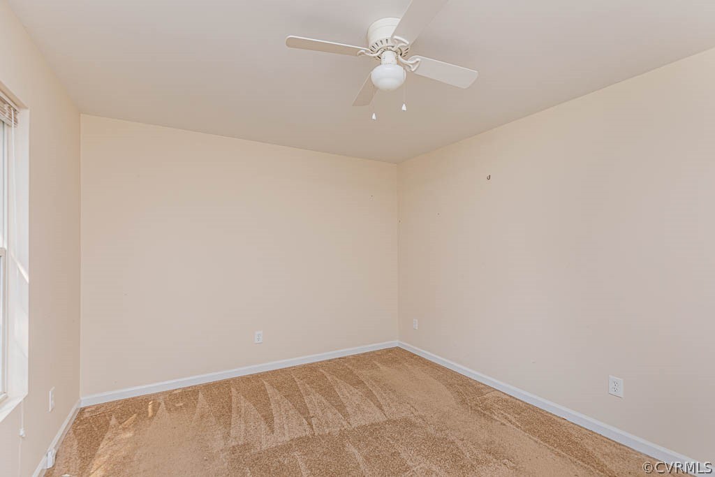 86 Riverside Drive Palmyra, VA 22963 - Photo 13 of 21 an empty room with a ceiling fan and a window
