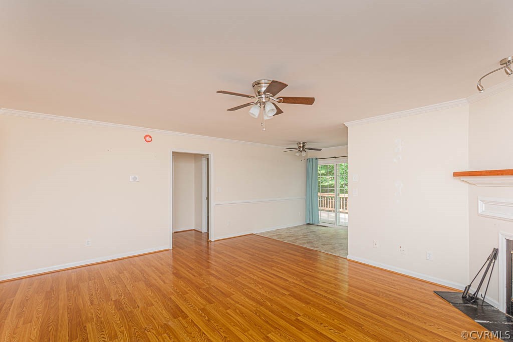 86 Riverside Drive Palmyra, VA 22963 - Photo 4 of 21 a view of a room with wooden floor and a ceiling fan
