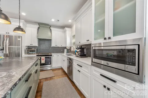 a bedroom with a bed and a fireplace