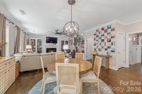 a kitchen with stainless steel appliances granite countertop a refrigerator a stove and a sink