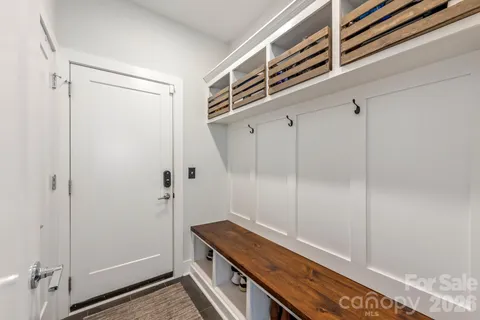 a view of sitting area with furniture and wooden floor