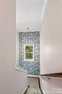 a view of a chairs and table in the backyard