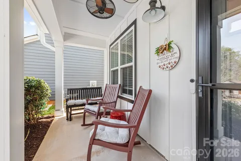 a view of a hallway with a dining area and livingroom view