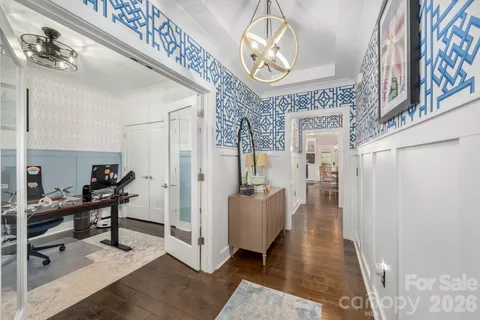 a view of a livingroom with furniture window and wooden floor