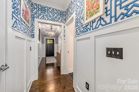 a living room with furniture fireplace and a window