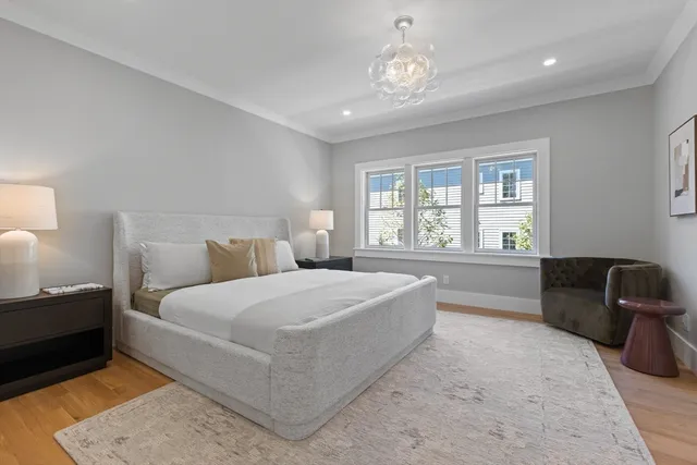 a spacious bedroom with a large bed and a couch