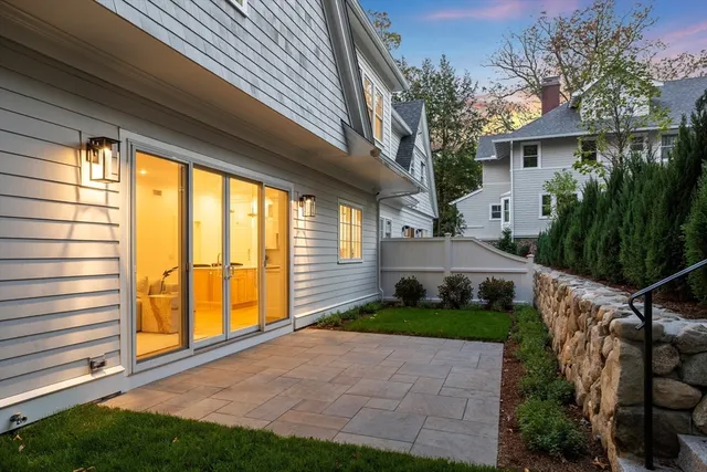 a view of backyard with patio