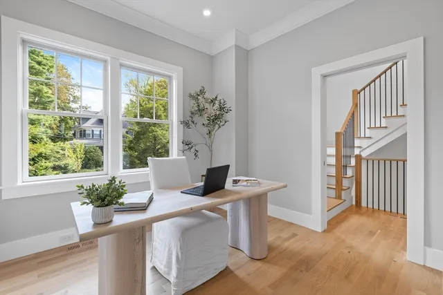 a view of a room that has a table and chair