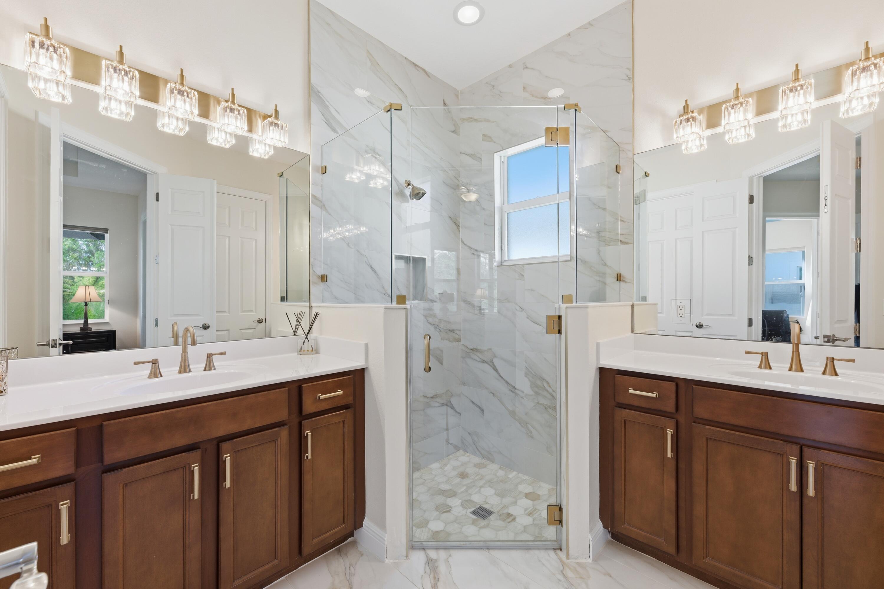 11473 Southwest Visconti Way Port St. Lucie, FL 34986 - Photo 17 of 69 a bathroom with a sink double vanity and a mirror