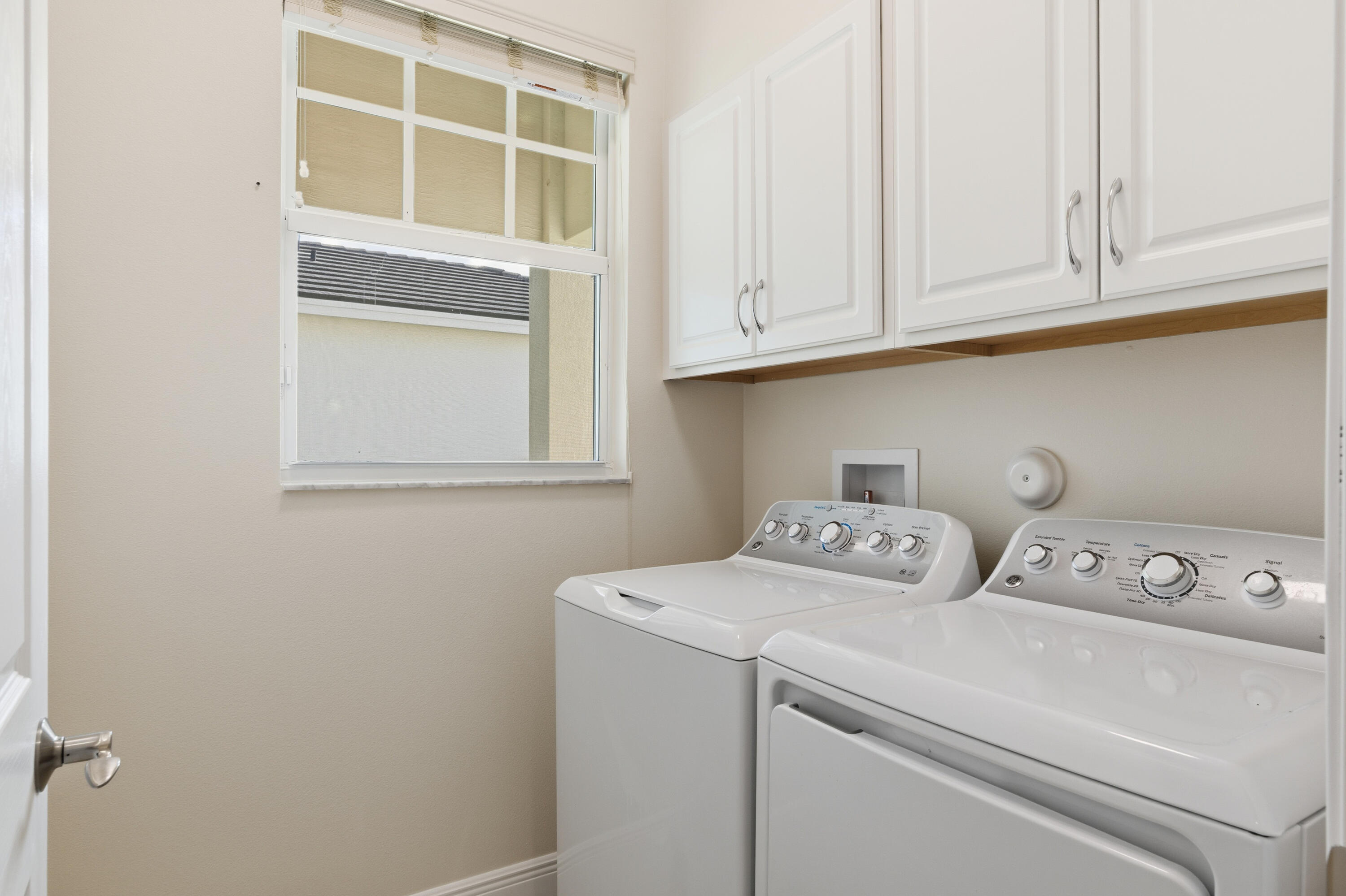 11473 Southwest Visconti Way Port St. Lucie, FL 34986 - Photo 22 of 69 a utility room with dryer and washer
