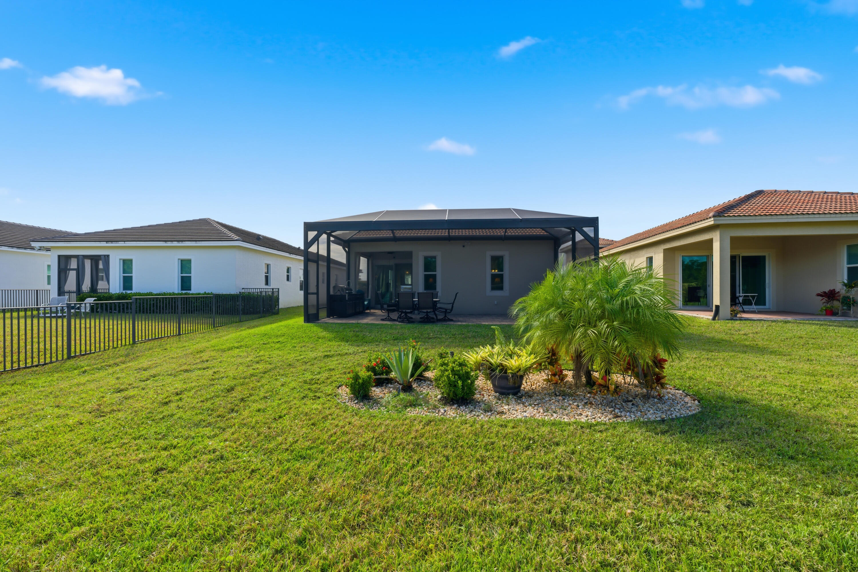 11473 Southwest Visconti Way Port St. Lucie, FL 34986 - Photo 25 of 69 a front view of a house with a garden