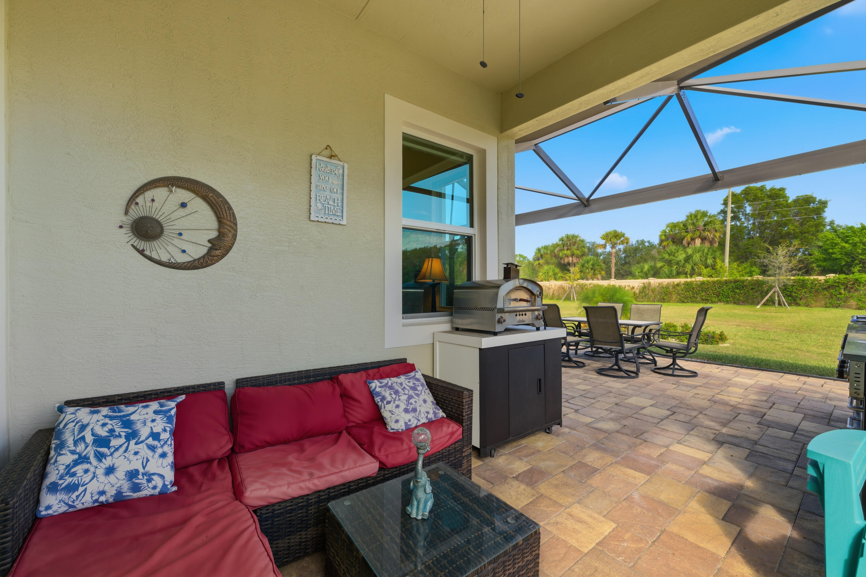 11473 Southwest Visconti Way Port St. Lucie, FL 34986 - Photo 29 of 69 a living room with furniture a rug and a large window
