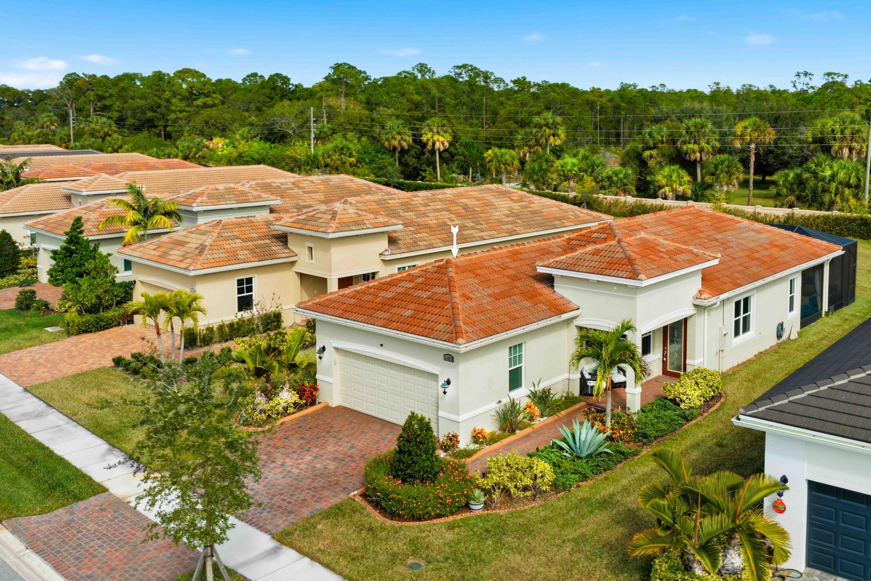 11473 Southwest Visconti Way Port St. Lucie, FL 34986 - Photo 30 of 69 an aerial view of a house with a yard