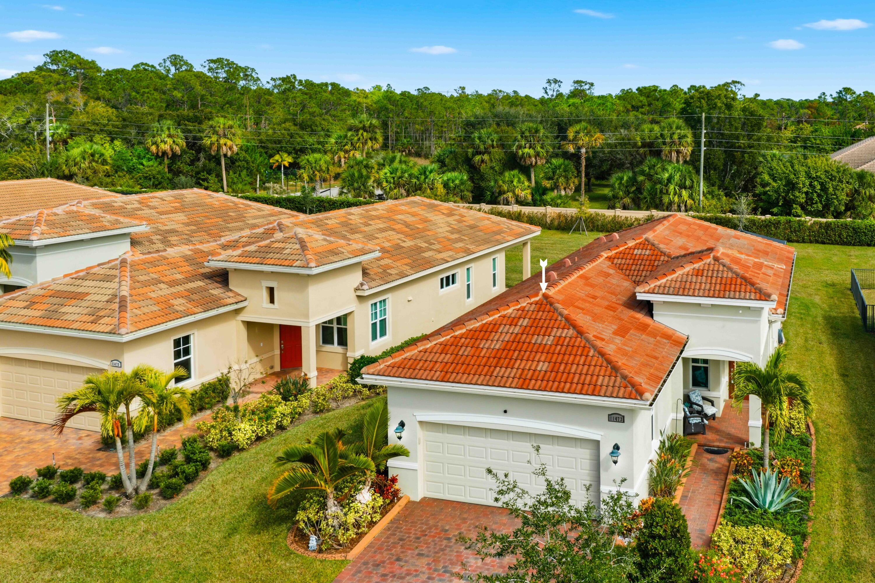 11473 Southwest Visconti Way Port St. Lucie, FL 34986 - Photo 31 of 69 an aerial view of a house with a yard