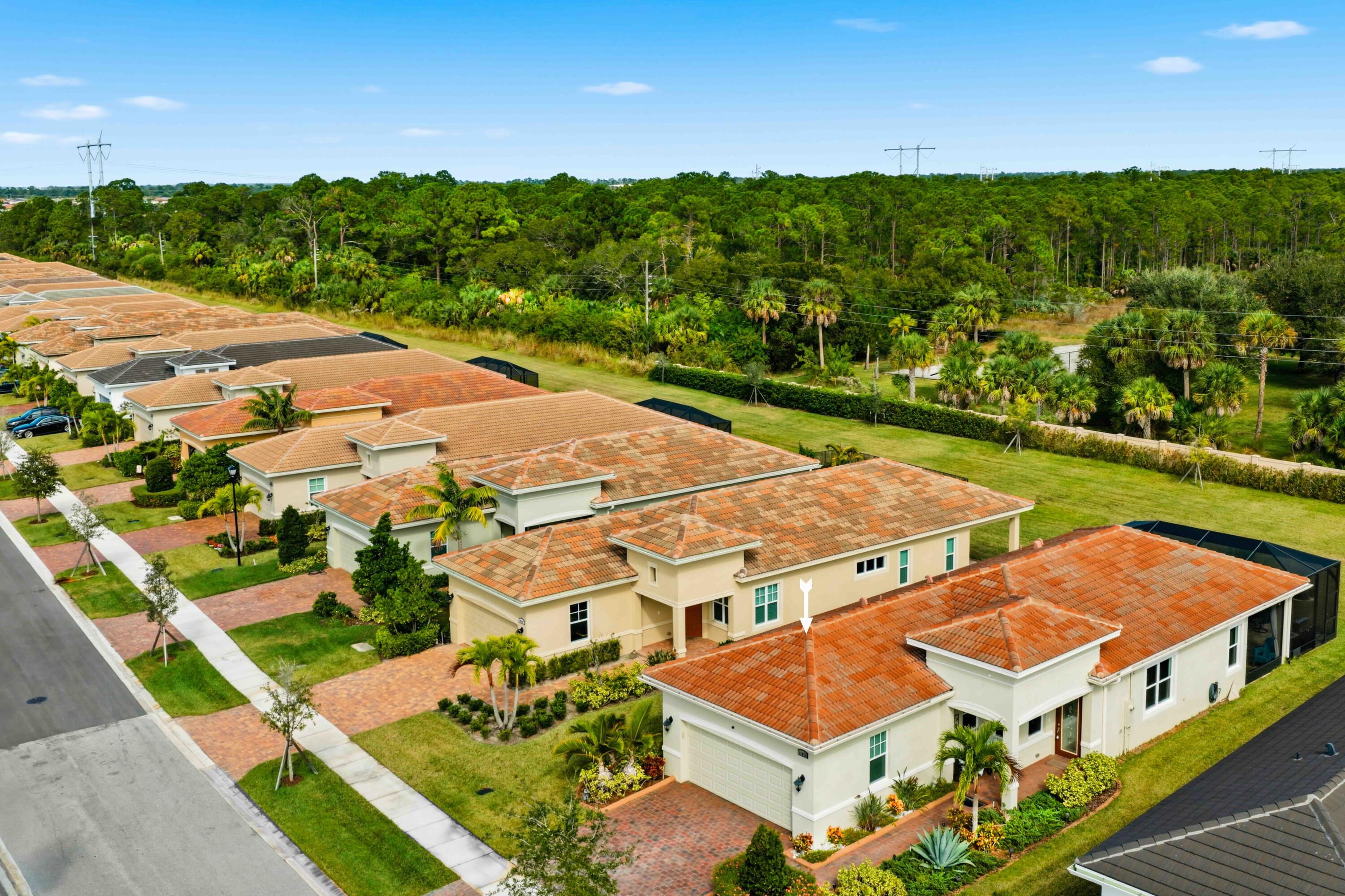 11473 Southwest Visconti Way Port St. Lucie, FL 34986 - Photo 39 of 69 an aerial view of an houses with outdoor space