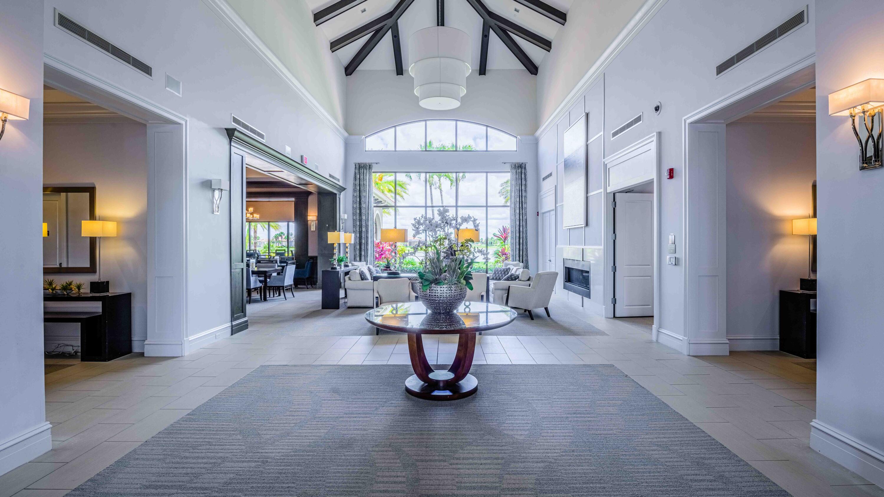 11473 Southwest Visconti Way Port St. Lucie, FL 34986 - Photo 46 of 69 a living room with furniture and a chandelier