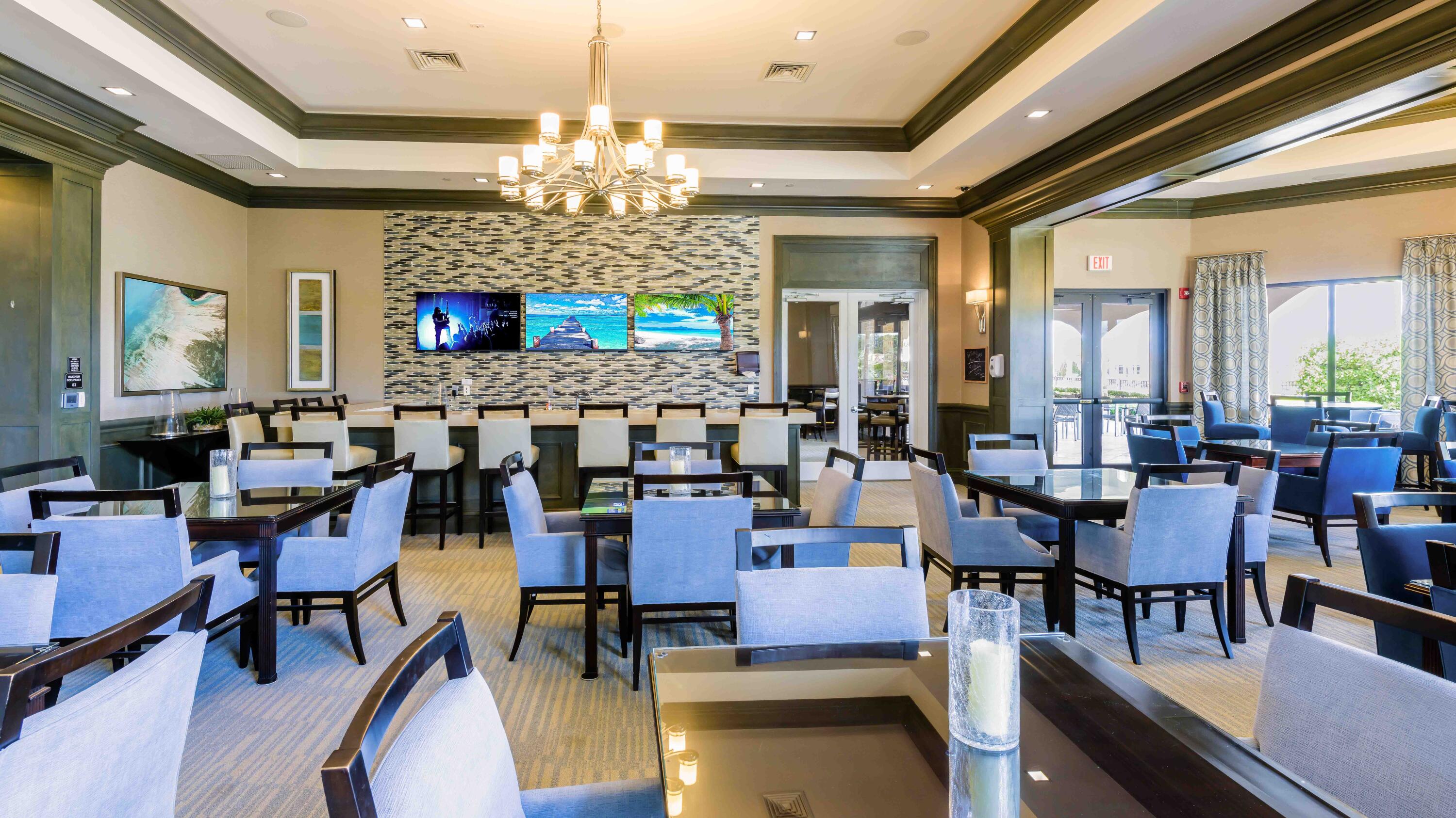 11473 Southwest Visconti Way Port St. Lucie, FL 34986 - Photo 47 of 69 a view of a dining room with furniture and chandelier