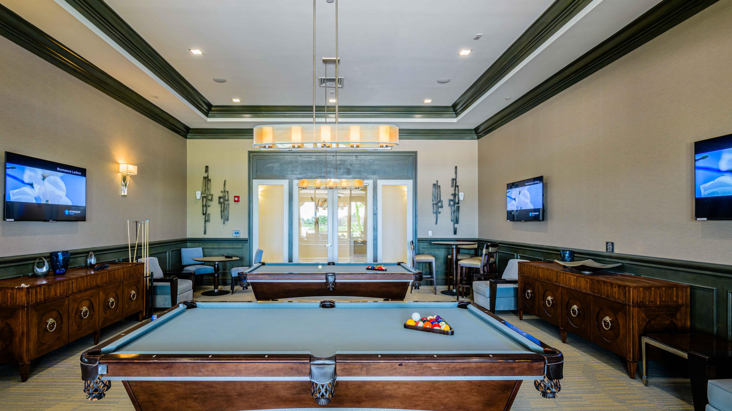 11473 Southwest Visconti Way Port St. Lucie, FL 34986 - Photo 48 of 69 a room with furniture pool table flat screen tv and windows