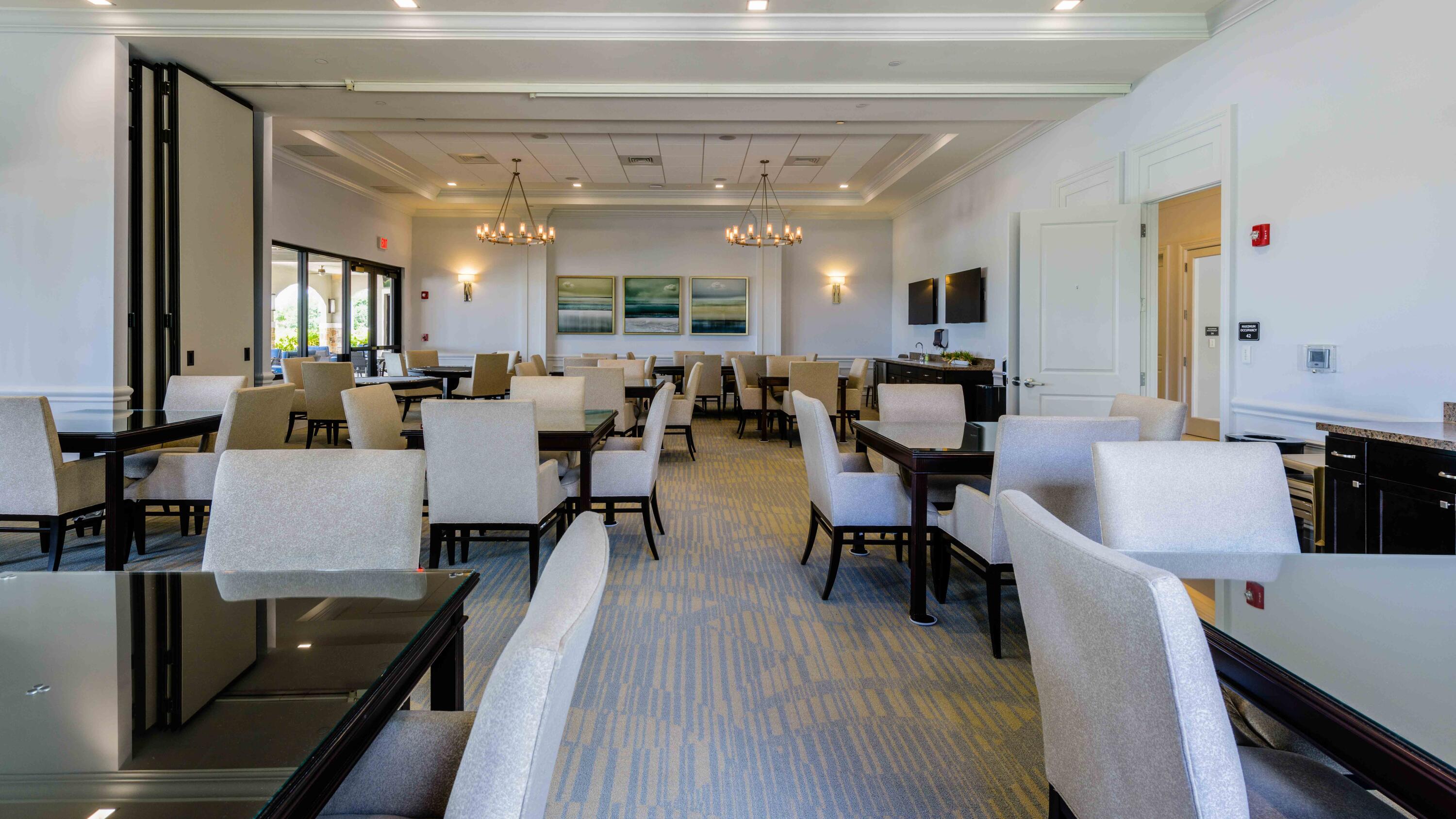 11473 Southwest Visconti Way Port St. Lucie, FL 34986 - Photo 50 of 69 a view of a dining room with furniture and wooden floor
